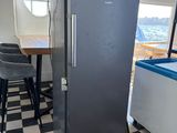 a black and white checkered floor in a kitchen with a refrigerator
