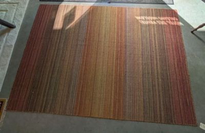 a rug on the floor in a living room