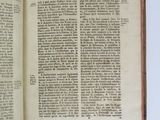 an open book on a table with a white background