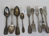a lot of silver spoons and forks on the table