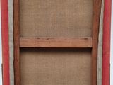 an old picture frame with a red frame and a white background