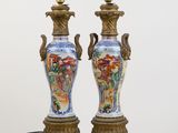 two vases that are sitting on a table