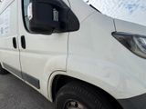 a white van parked on the side of the road