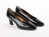 a pair of black pumps on a white background