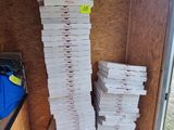 boxes of pizza stacked on top of each other in a storage area
