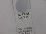 a tag that says house of coussin next to a pair of shoes