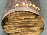 a close up of a piece of wood with writing on it
