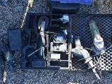 a box with tools in it sitting on the ground
