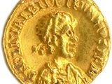 une pièce d'or portant l'image d'un homme