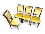 a set of four chairs with yellow upholstered upholstered upholstered upholstered upholstered upholstered upholstered