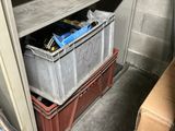 a small storage area with boxes and boxes on the floor