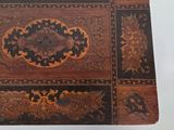 a small wooden box with a decorative design on it