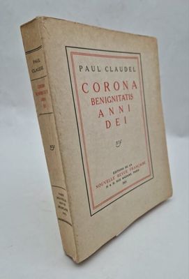 an old book sitting on top of a table on a white surface