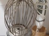 a whisk in a metal bowl on a counter