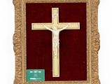 an image of a wooden crucif with a gold cross on a red background