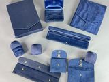 several pieces of blue leather are laid out on a table