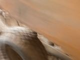 a blurry photo of a car driving on a dirt road