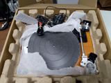 a record in a cardboard box on a table