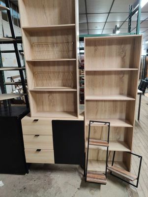 a lot of bookshelves and a desk in a store