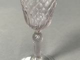 a close up of a wine glass on a table