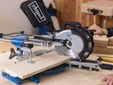 someone is using a circular saw to cut a piece of wood