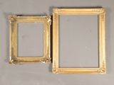 pair of antique gold picture frames on grey background