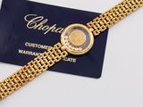 a close up of a watch on a gold bracelet