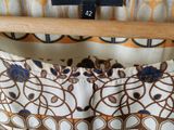 an image of a close up of a dress on a hanger