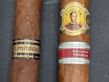 a couple of cigars sitting next to each other on a table