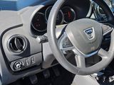 dashboard of a car with a steering wheel and dashboard controls