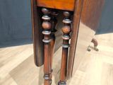 a small wooden table with a small table top on it