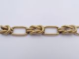 a close up of a gold chain with a link on it