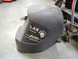 an image of a helmet on the ground in a garage