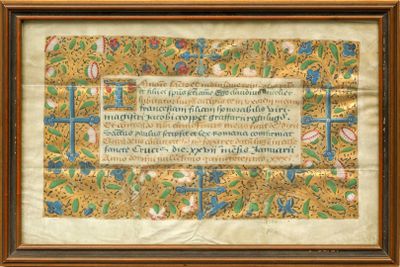 un ancien manuscrit orné d'une bordure dorée et d'une bordure bleue et verte