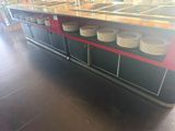 many plates stacked on the counter in the restaurant