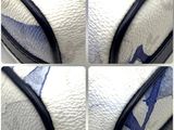 four pictures of a close up of a basketball ball with a blue and white design