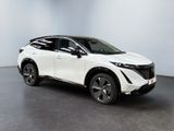 the white toyota c - hr suv is parked in a large room