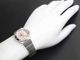 a woman ' s wrist that has a watch on it