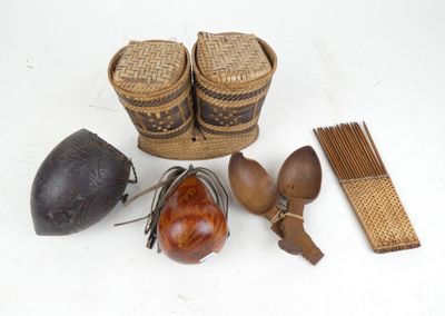 a basket, spoons, and other items that are on the table