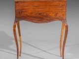 a small table with a drawer on the top of it