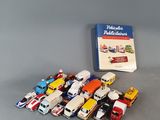 a lot of toy cars and a book on the table