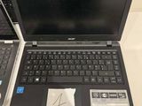 two laptops that are sitting on a table