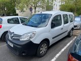 a white van parked in a parking lot next to other cars