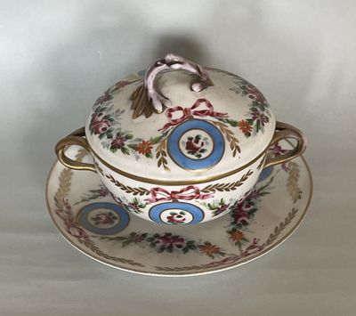 a bowl and saucer sitting on a saucer on a plate