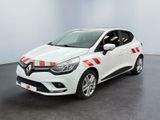 une voiture blanche avec des bandes rouges garée dans une pièce
