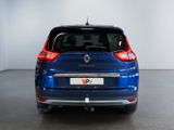 the rear end of a blue car parked in a garage