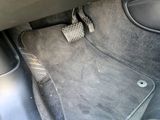 a car floor mat with a heart shaped pad on it