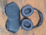 a pair of headphones and a case on a table