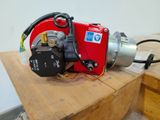 a red machine that is sitting on top of a wooden table