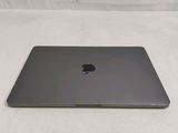 an apple macbook air laptop computer sitting on top of a white surface